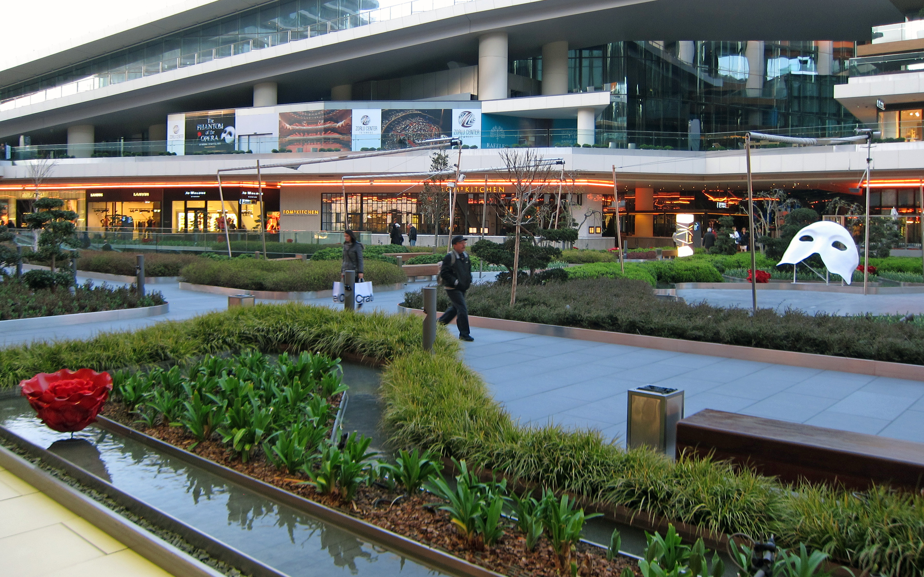 Shopping mall with plant beds and water features