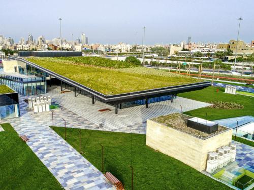 Pitched green roof, surrounded by lawn an walkways